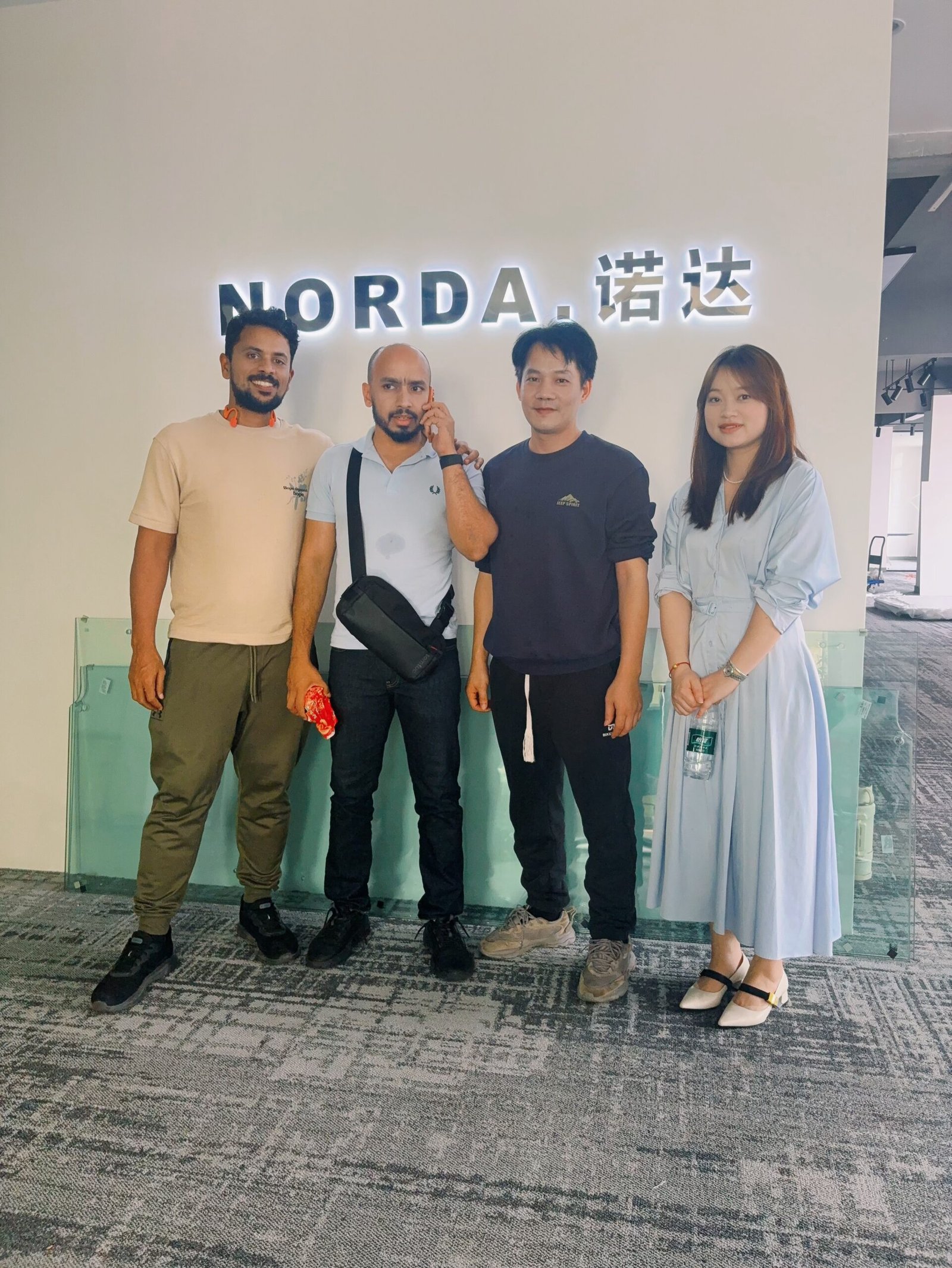 Visitors and NORDA representatives meeting in the showroom