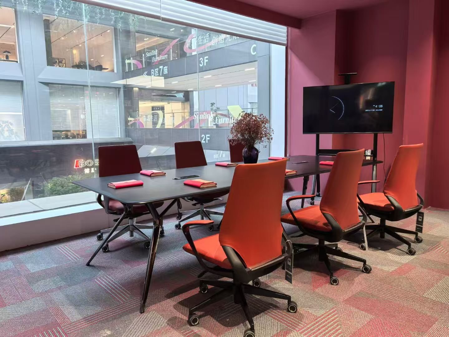 Meeting furniture with red task chairs in a commercial interior